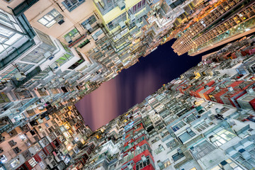 HongKong. Old tall and dense residential building in Hong Kong at dusk.