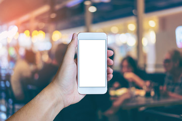Man's hand shows mobile smartphone with white screen in vertical position