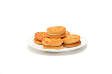 Creamy cookies on plate isolated on white