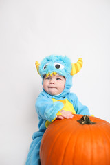 Baby dressed up for Halloween in a monster costume
