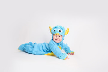 Baby dressed up for Halloween in a monster costume
