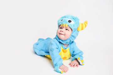 Baby dressed up for Halloween in a monster costume