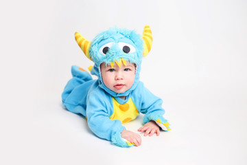 Baby dressed up for Halloween in a monster costume