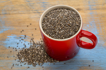 black chia seeds in a coffee cup