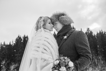 Lovers bride and groom on their winter wedding