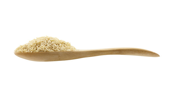 Brown Rice On Spoon On White Background