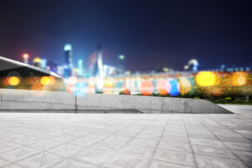 empty marble floor with modern bridge and buildings
