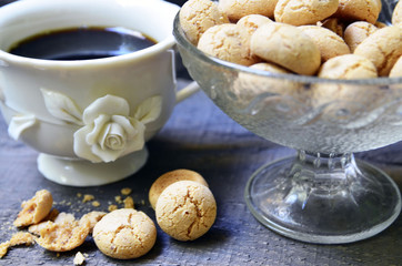 Amaretti cookies.Typical Italian almond amarettini biscuits and cup of coffee close up.Selective focus.