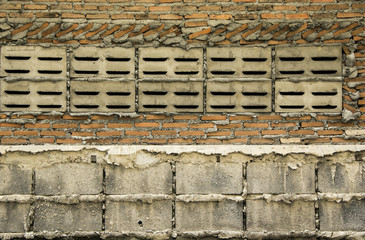 Background and Wallpaper or texture of Bare wall or flap are rough built. Consisting of cement block and brick and the vents are made of cement blocks.