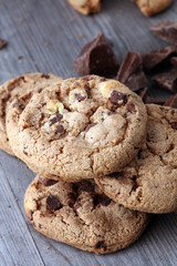 Chocolate cookies on wooden table. Chocolate chip cookies shot.