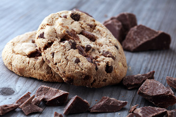 Chocolate cookies on wooden table. Chocolate chip cookies shot.