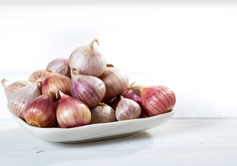 Fresh healthy garlic on white table