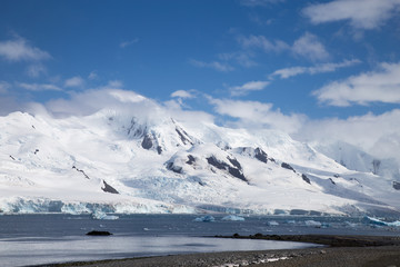 Snow and glaciers on top of mountains in the South Shetland Islands, Antarctica.