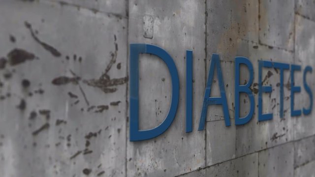 Close up Shooting metal wall with word diabetes