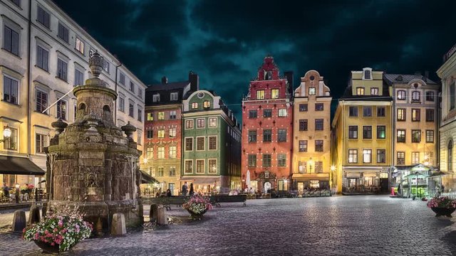 Stortorget square with colorful houses in the center of Old Town of Stockholm, Sweden at dusk (static image with animated sky)
