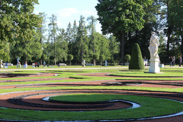 Landscape colored grass cycles lawn with monument in Eckaterinian public park in St Petergurg