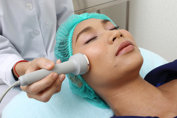 Treatment on Asian Woman as patient to make skin smooth bright