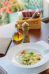 Italian food - rigatoni pasta with basil and black truffle.