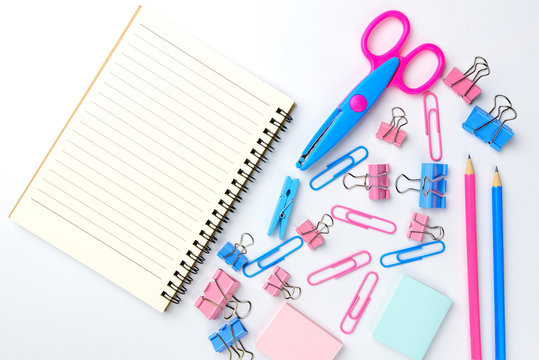 Stationary concept, Flat Lay top view Photo of school supplies scissors, pencils, paper clips,calculator,sticky note,stapler and notepad in pastel tone on white background with copy space, flat lay 