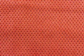 Texture of natural linen fabric in pattern orange color close-up in vintage style