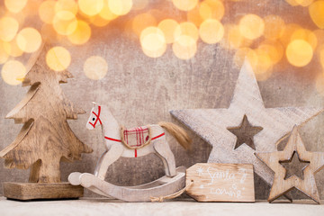 Christmas tree decorations on a wooden background. With bokeh ornaments.