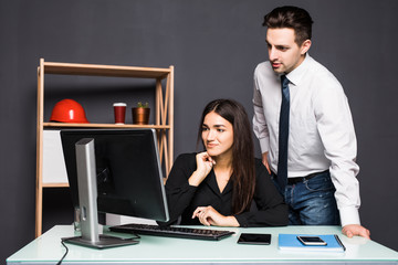 Business people discussing ideas at meeting using laptop in the office. Team work.