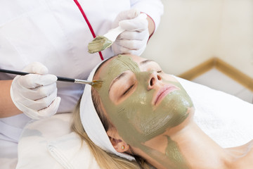 Process cosmetic mask of massage and facials in beauty salon 