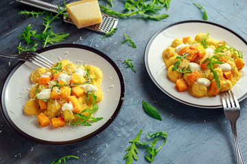 Homemade Butternut squash gnocchi with wild rocket and parmesan, ricotta cheese