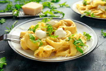 Ravioli with Parmesan and wild rocket on plate