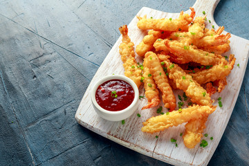 Fried Shrimps tempura with sweet chili sauce on white wooden board