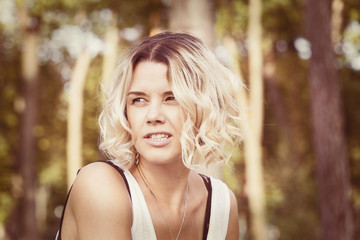 Portrait of a girl in a summer park outdoors 