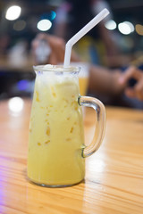 Ice milk with banana in glass jar