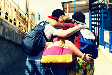 Happy friends embrace. Concept: a holiday in the summer. Vacation, travel. A company of young...