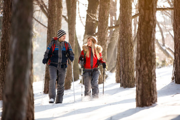 Female and male hiker walking in forest