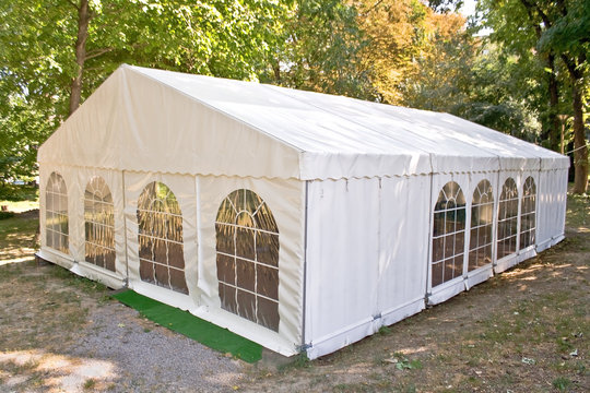 White big tent in forest