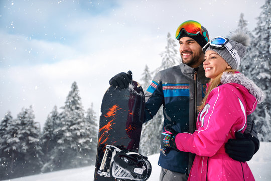 Couple enjoy skiing on mountain