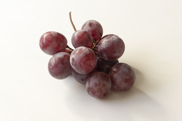 A bunch of grapes on a background of a white color