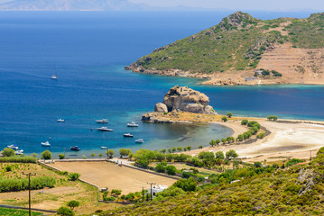 Fototapeta na wymiar Petra beach is a picturesque beach on the island of Patmos, aerial view in a Sunny summer day, Patmos island, Dodecanese, Greece