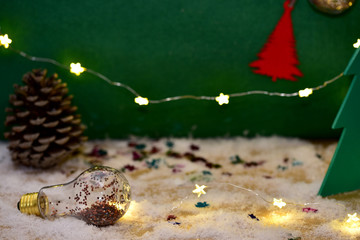 Christmas or New Year green background with a snow in a foreground.