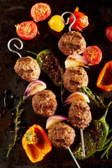 Roasted meatballs with peppers and tomatoes