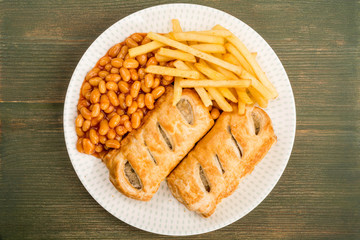 Sausage Rolls With Baked Beans Chips And French Fries