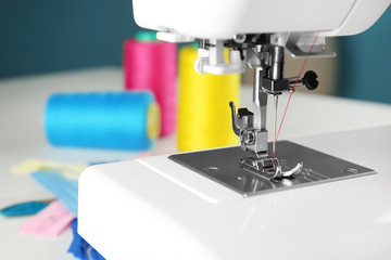 Sewing machine on table, closeup