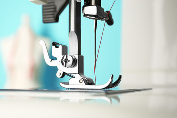 Sewing machine on table, closeup