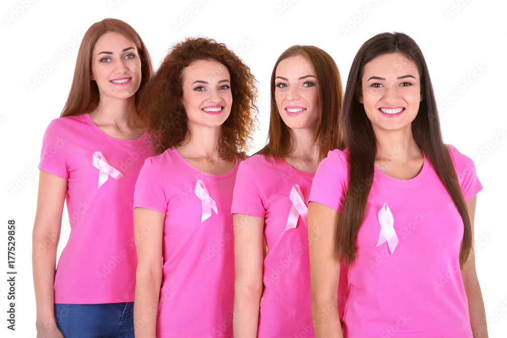 Canvas Prints Young women in pink t-shirts on white background. Breast cancer awareness concept