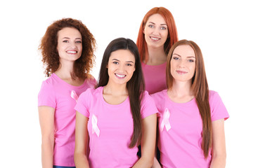 Young women in pink t-shirts on white background. Breast cancer awareness concept