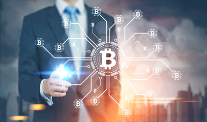 Obraz premium Glowing finger businessman, bitcoin network