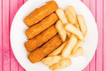 Fototapeta na wymiar Grilled Cod Fish Fingers With Chunky Chips