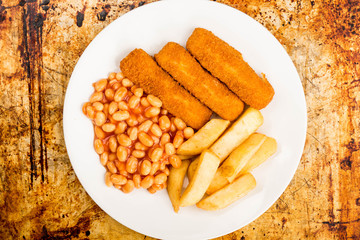Grilled Cod Fish Fingers With Chunky Chips And Baked Beans in Tomato Sauce