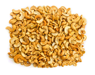 Heap roasted and salted Cashew nuts on a white background. Top view, flat lay.