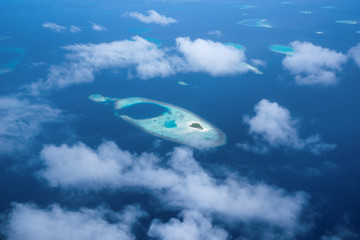 Naklejka na ściany i meble Aerial View from seaplane window over Atolls at Indian Ocean Maldives